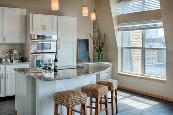 Open breakfast bar and center islands in select homes